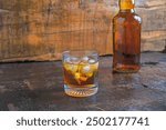 Liquor and liquor bottles on wooden table