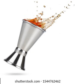 Liquor Spilling Out Of A Tilted Jigger Isolated On White Background