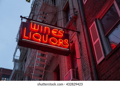 Liquor Store Neon Sign On Brick Building Background