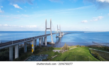 Lisboa, Portugal, April 24, 2022: Aerial View Of The Vasco Da Gama Bridge Is A Cable-stayed Bridge Located In The City Of Lisbon And Crosses The Tagus River. It Is The Second-longest Bridge In Europe.