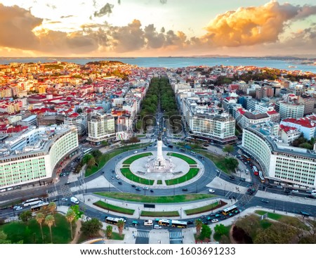 Lisbon aerial skyline panorama european city view on marques de pombal square monument, sunset outside crossroads portugal