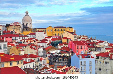 Lisbon cityscape with the colorful Alfama district, showcasing its historic charm and vibrant atmosphere, a popular travel destination in Portugal