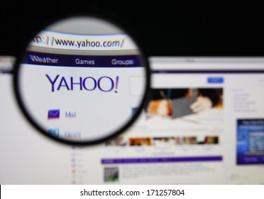 LISBON - JANUARY 14, 2014: Photo of Yahoo homepage on a monitor screen through a magnifying glass.