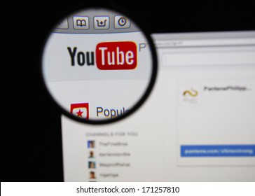 LISBON - JANUARY 14, 2014: Photo Of Youtube Homepage On A Monitor Screen Through A Magnifying Glass.