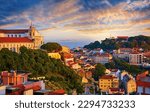 Lisbon panorama of sunset. Portugal. Evening picturesque with beautiful sky and sunny light at houses historic old town in district Alfama Lisboa
