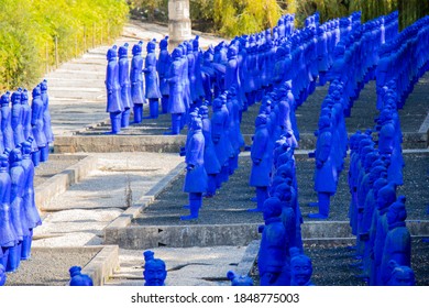 Lisbon - Portugal: 03/09/2020 A copy of The Terracotta Army, collection of terracotta sculptures, in blue color color in the buddha Garden, Bacalhôa Buddha Eden, asian style garden.