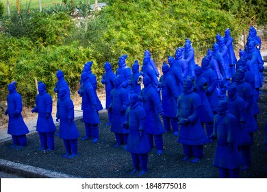 Lisbon - Portugal: 03/09/2020 A copy of The Terracotta Army, collection of terracotta sculptures, in blue color color in the buddha Garden, Bacalhôa Buddha Eden, asian style garden.
