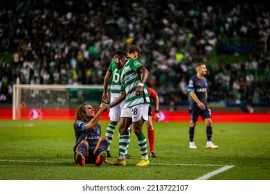 Lisbon, Portugal - 10 12 2022: UCL Game Between Sporting CP And Olympique De Marseille; Fatawu Issahaku Helps Matteo Guendouzi Gets Up