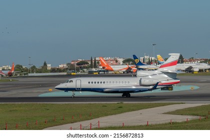 LISBON, PORTUGAL - Apr 15, 2022: A Private Owner Company Cirrus SR20 Plane Awaiting Orders To Take Off At Lisbon Airport