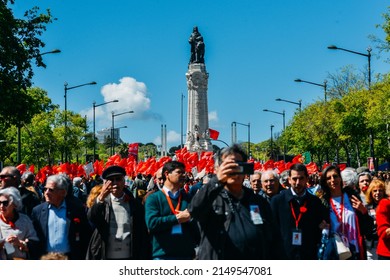 Lisbon, Portugal - April 25, 2022: Crowds Of Portuguese Hold Carnation Flowers At Avenida Da Liberdade In Lisbon To Celebrate The Military Coup That Overthrew The Authoritarian Regime In 1974