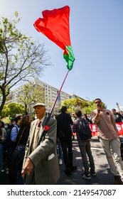 Lisbon, Portugal - April 25, 2022: Crowds Of Portuguese Hold Carnation Flowers At Avenida Da Liberdade In Lisbon To Celebrate The Military Coup That Overthrew The Authoritarian Regime In 1974