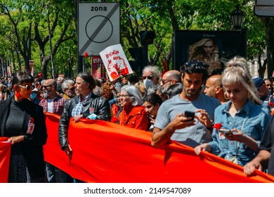 Lisbon, Portugal - April 25, 2022: Crowds Of Portuguese Hold Carnation Flowers At Avenida Da Liberdade In Lisbon To Celebrate The Military Coup That Overthrew The Authoritarian Regime In 1974