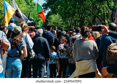 Lisbon, Portugal - April 25, 2022: Crowds Of Portuguese Hold Carnation Flowers At Avenida Da Liberdade In Lisbon To Celebrate The Military Coup That Overthrew The Authoritarian Regime In 1974