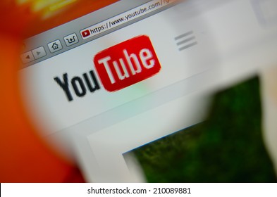 LISBON, PORTUGAL - AUGUST 3, 2014: Photo Of Youtube Homepage On A Monitor Screen Through A Magnifying Glass.