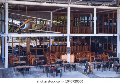 Lisbon. Portugal. December 07, 2017: Irish Pub On The Tejo River Embankment In The Nations Park In Lisbon. The Original Design On The Open Terrace Of The Second Floor Is A Vintage Airplane. Interior.