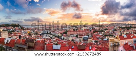 Lisbon, Portugal downtown skyline panorama towards the Tagus River during a beautiful sunset.