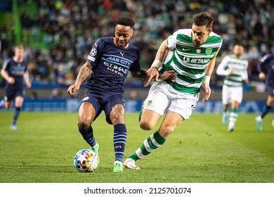 Lisbon, Portugal, Estadio Jose Alvalade - 02 15 2022: Champions League Best of 16 - Sporting CP - Manchester City; Raheem Sterling fights for the ball with Sebastian Coates