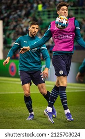 Lisbon, Portugal, Estadio Jose Alvalade - 02 15 2022: Champions League Best Of 16 - Sporting CP - Manchester City; John Stones Gets The Ball From Ruben Dias During Warm Up