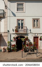 LISBON, PORTUGAL - Feb 22, 2009: A Flower Shop And A Typical Building With A Balcony In Lisbon, Portugal