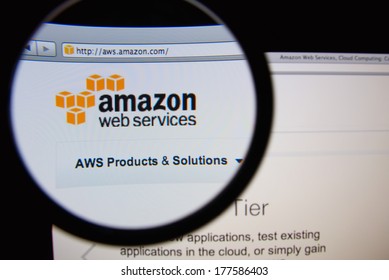 LISBON, PORTUGAL - FEBRUARY 19, 2014: Amazon Web Services Homepage Through A Magnifying Glass. AWS Is A Collection Of Web Services That Together Make Up A Cloud Computing Platform.