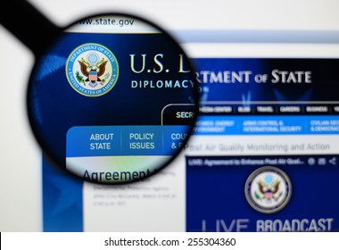 LISBON, PORTUGAL - February 24, 2015: Photo Of Us Department Of State Page On A Monitor Screen Through A Magnifying Glass.