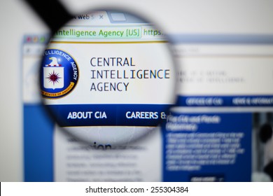 LISBON, PORTUGAL - February 24, 2015: Photo of cia central intelligence agency. page on a monitor screen through a magnifying glass.