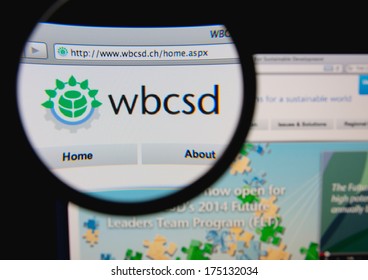 LISBON, PORTUGAL - FEBRUARY 6, 2014: Photo Of World Business Council For Sustainable Development Homepage On A Monitor Screen Through A Magnifying Glass.