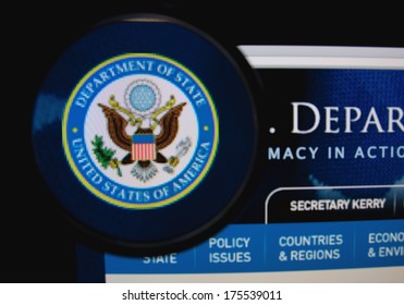 LISBON, PORTUGAL - FEBRUARY 8, 2014: Photo Of The U.S. Department Of State Homepage On A Monitor Screen Through A Magnifying Glass.