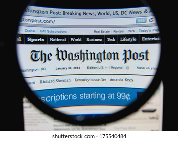 LISBON, PORTUGAL - FEBRUARY 8, 2014: Photo of The Washington Post homepage on a monitor screen through a magnifying glass.
