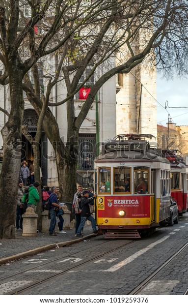 Lisbon, Portugal - January 1, 2018: Vintage\
tram-car on Lisbon sightseeing tram\
line.