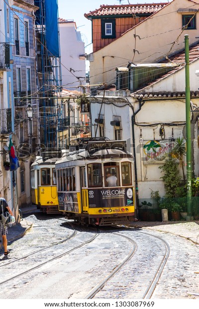 LISBON, PORTUGAL - JULY\
30, 2017 : Vintage tram in the city center of Lisbon, Portugal in a\
summer day