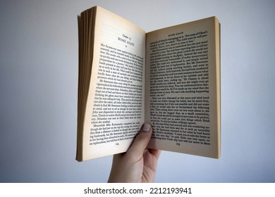 Lisbon, Portugal - October 03th, 2022: Female Hand Holding An Open Book. English Text, From The Book 