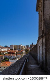 LISBON, PORTUGAL - OCTOBER 10, 2019: View Of Águas Livres Aqueduct On Right Side And Cityscape On A Left Side.