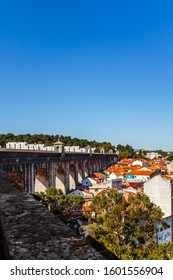 LISBON, PORTUGAL - OCTOBER 10, 2019: Águas Livres Aqueduct And Private Houses In Bairro Da Liberdade.