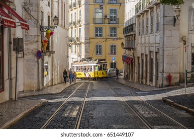 LISBON, PORTUGAL - OCTOBER, 2016: Cityscape. Romantic Lisbon street with the typical vintage yellow tram in Lisbon.