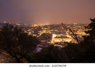 Lisbon, Portugal - October 27, 2020: Night View Of Lisbon, The Capital And The Largest City Of Portugal, City Lights, Clouds And Fog In Lisbon, Portugal, On October 27th, 2020