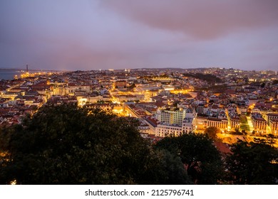 Lisbon, Portugal - October 27, 2020: Night View Of Lisbon, The Capital And The Largest City Of Portugal, City Lights, Clouds And Fog In Lisbon, Portugal, On October 27th, 2020