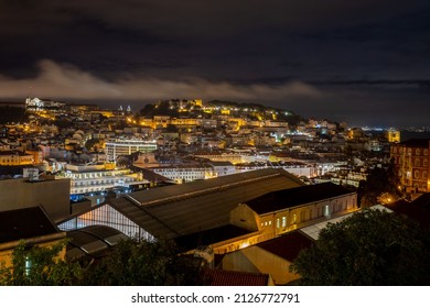 Lisbon, Portugal - October 27, 2020: Night View Of Lisbon, The Capital And The Largest City Of Portugal, City Lights, Clouds And Fog In Lisbon, Portugal, On October 27th, 2020