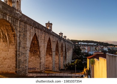 LISBON, PORTUGAL - OCTOBER 8, 2019: Águas Livres Aqueduct In Lisbon During Sunset.