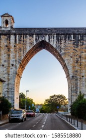 LISBON, PORTUGAL - OCTOBER 8, 2019: Cars Parked On Rua 12, That Is Going Through An Arch Of Águas Livres Aqueduct In Lisbon.