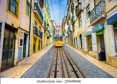 Lisbon, Portugal Old Town Streets And Tram.