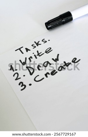 List of completed tasks written with marker.
red black marker.