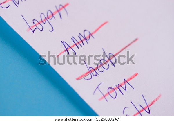 List with crossed names. Choosing a name or making
guest list