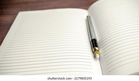 list of numbers on white notepad with pen on it - Shutterstock ID 2179835193