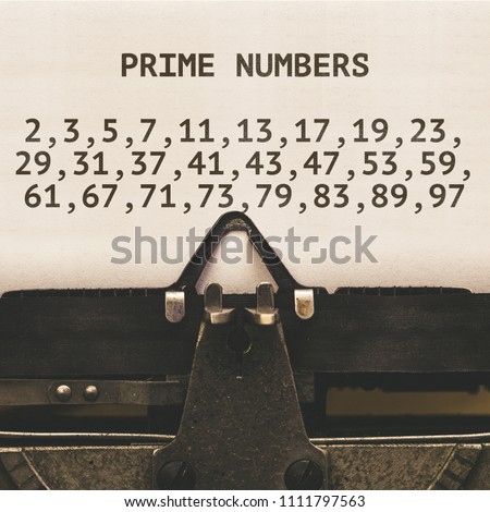 List of Prime Numbers below 100 on paper in vintage type writer machine from 1920s closeup with paper