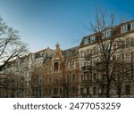 Listed row of houses at the "Stargarder Straße" street in Berlin-Prenzlauer Berg in morning light - graffiti daubs were removed