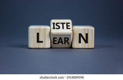 Listen and learn symbol. Turned a wooden cube and changed the word 'listen' to 'learn'. Beautiful grey background, copy space. Business, education and listen and learn concept. - Shutterstock ID 1914009598