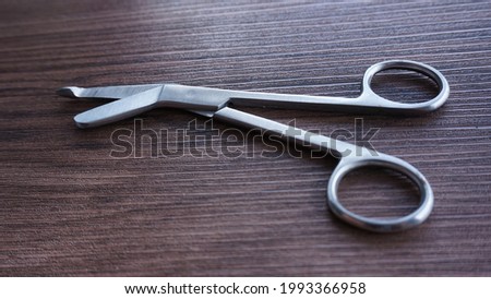 Lister Bandage Scissors on the table, surgical equipment for small animal veterinarians

