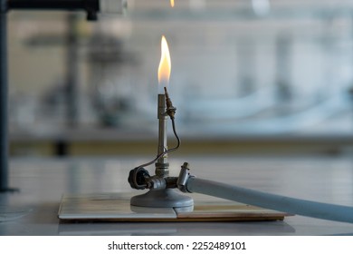 Lit bunsen in the chemistry laboratory. - Powered by Shutterstock