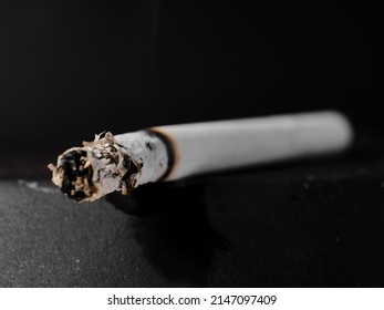 A Lit Cigarette In An Ashtray